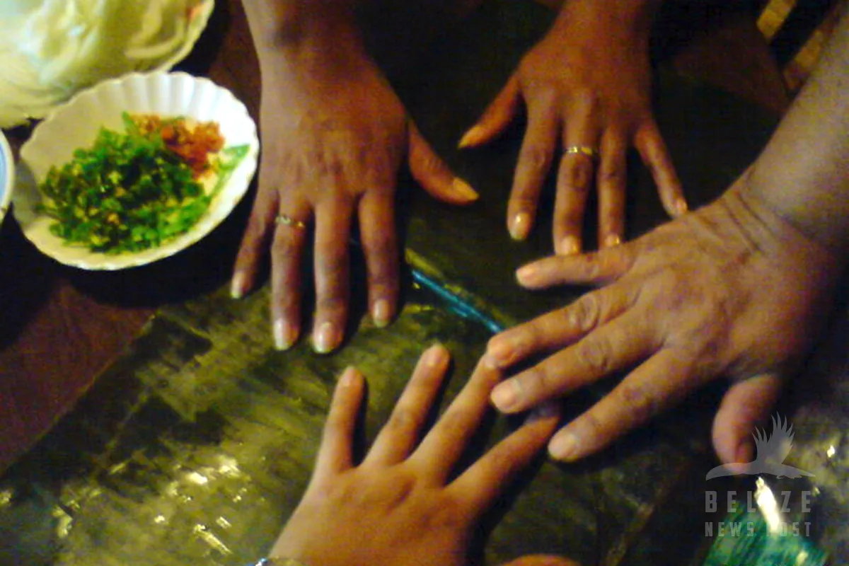 Many Hands to make Belizean Tamales
