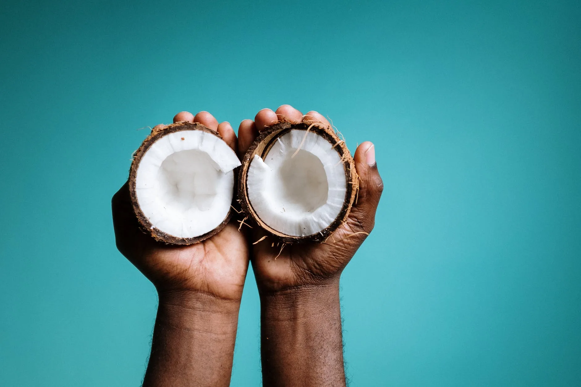 photo of person holding coconut