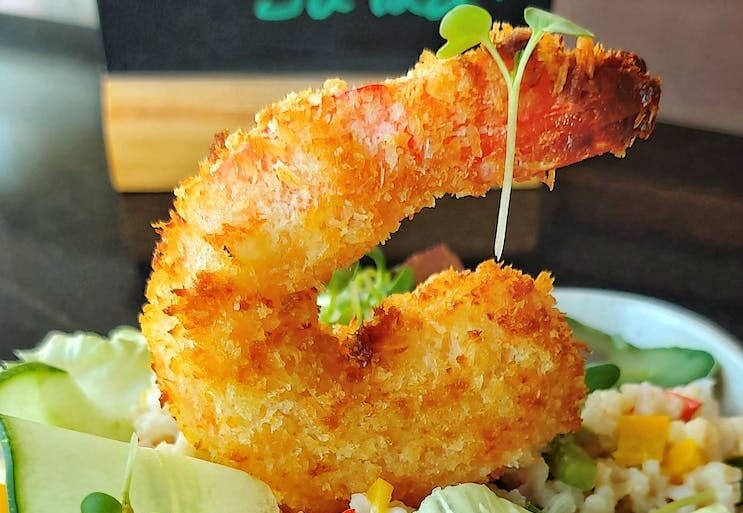 salad with fried shrimp in cafe
