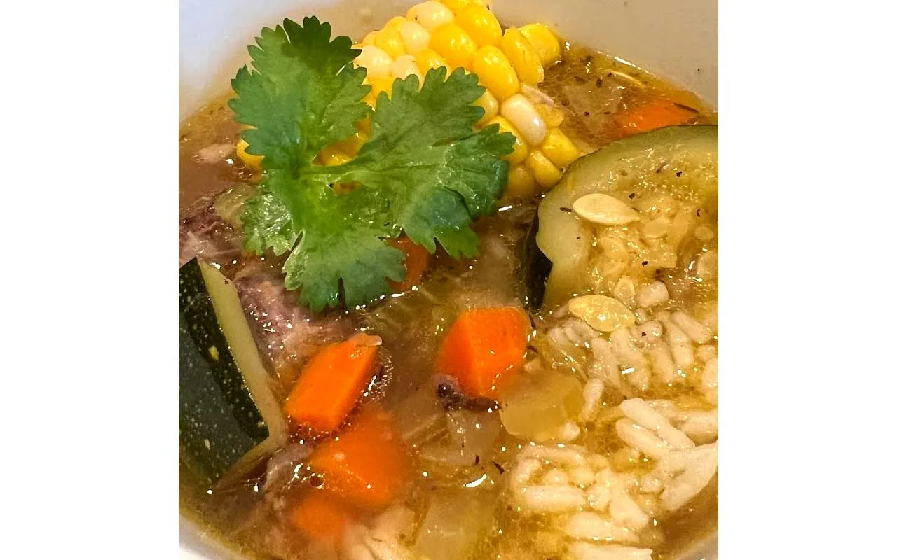 Belizean Beef Soup Plated with Garlic Rice and Corn on the Cobb - Belize Food Recipe by Belize News Post