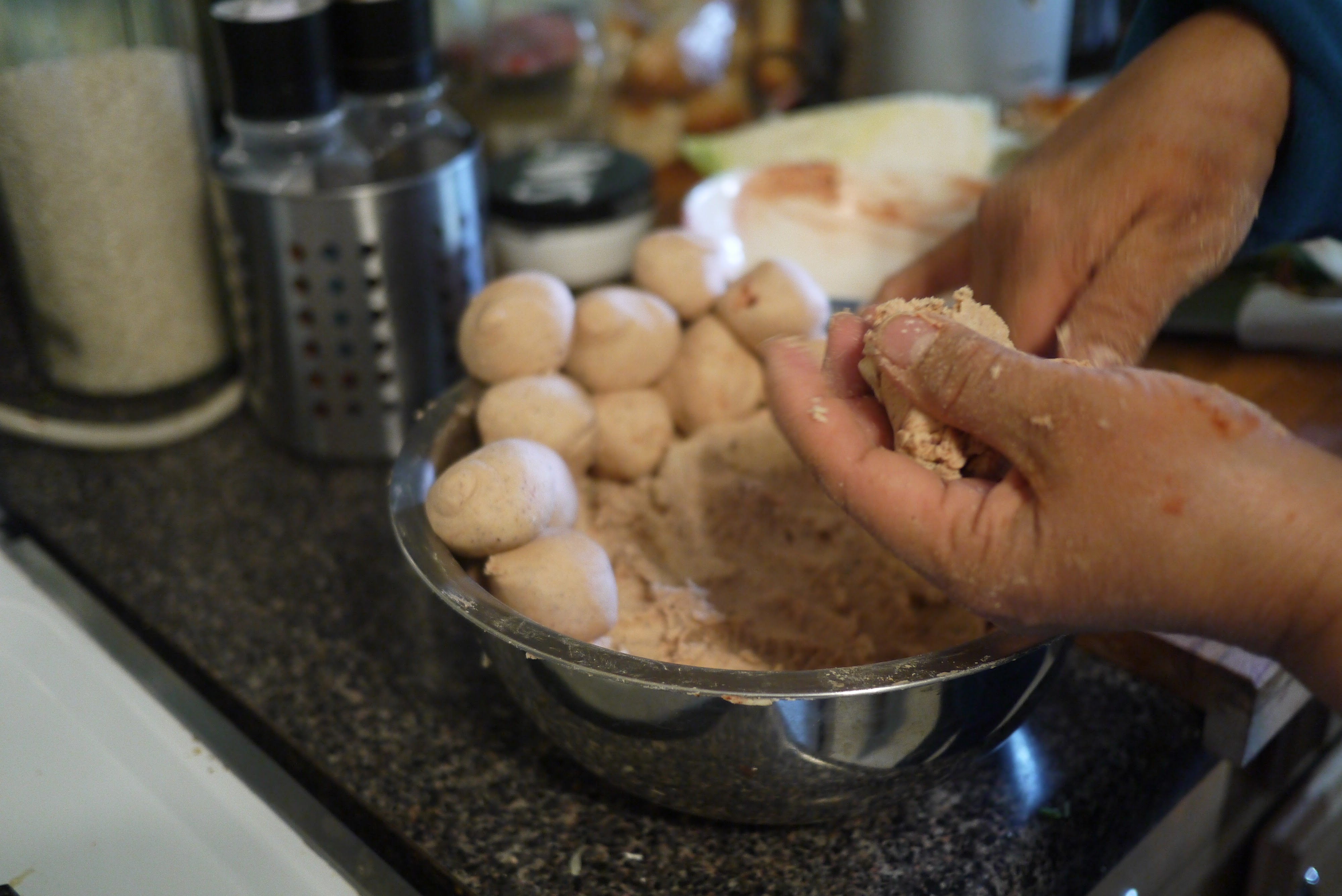 batch of masa balls formed and ready to press for Belizean corn tortillas