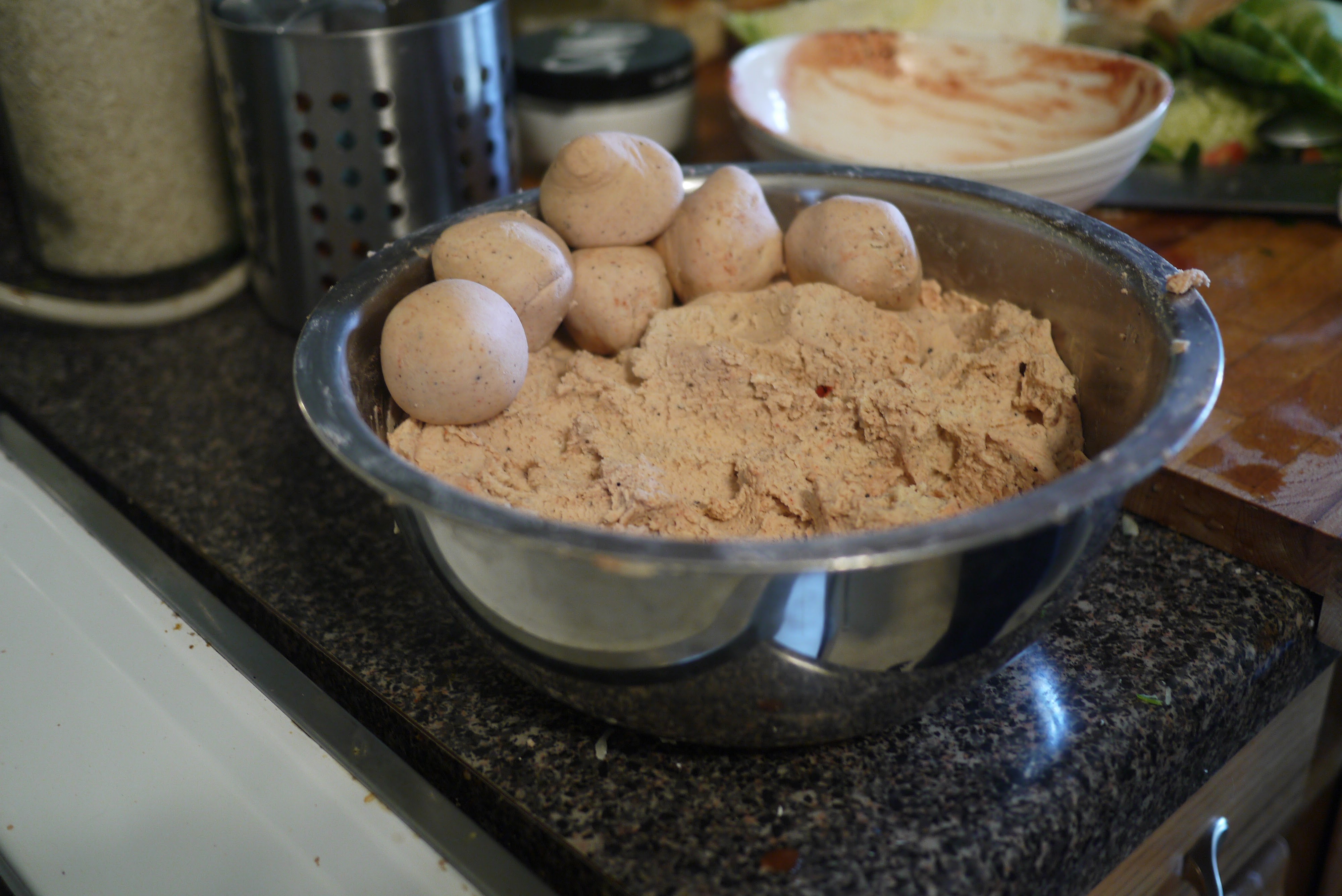 bowl of masa dough with portioned balls for homemade Belizean corn tortillas — masa harina mixed with water and salt