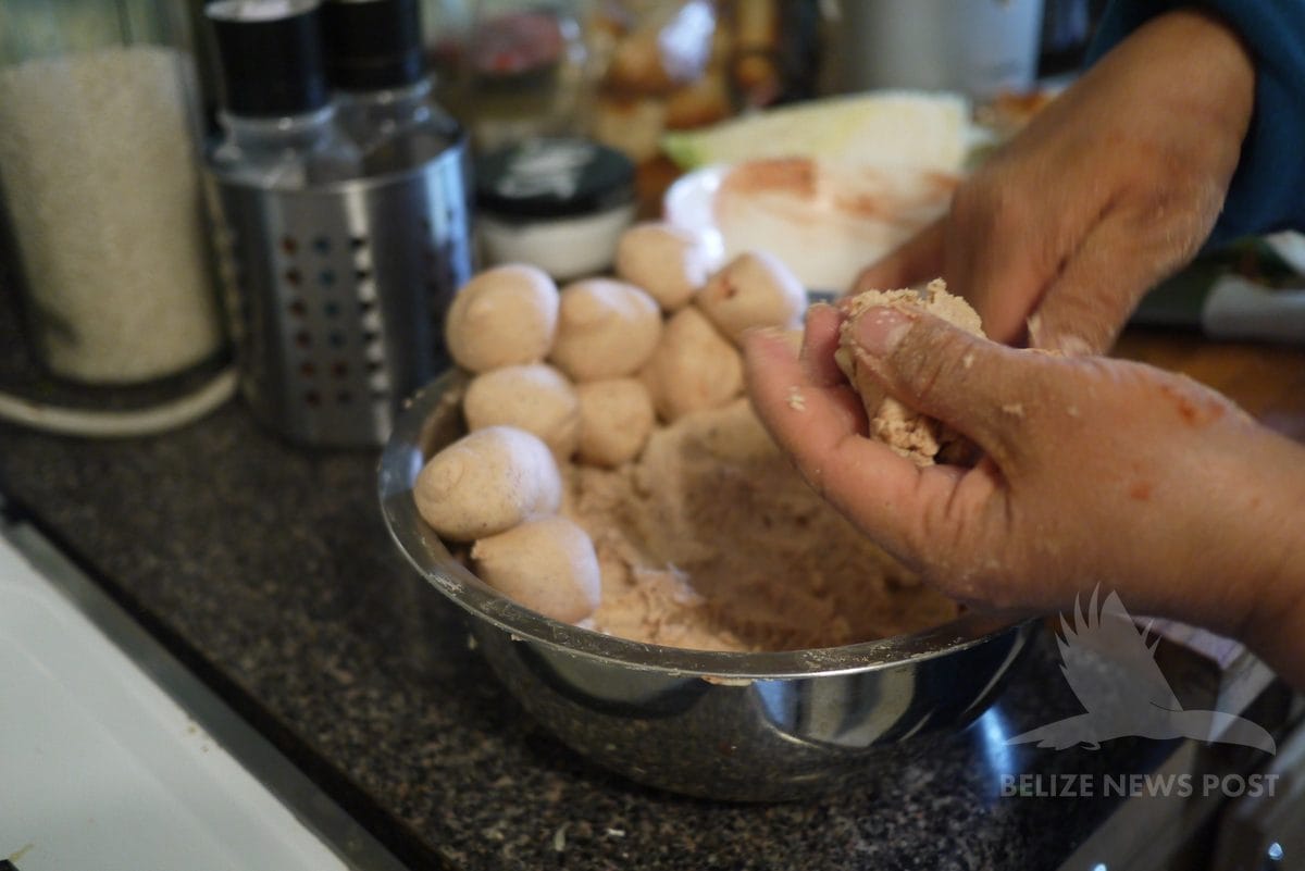 Batch of formed corn masa balls ready to cook in bean broth for joroches