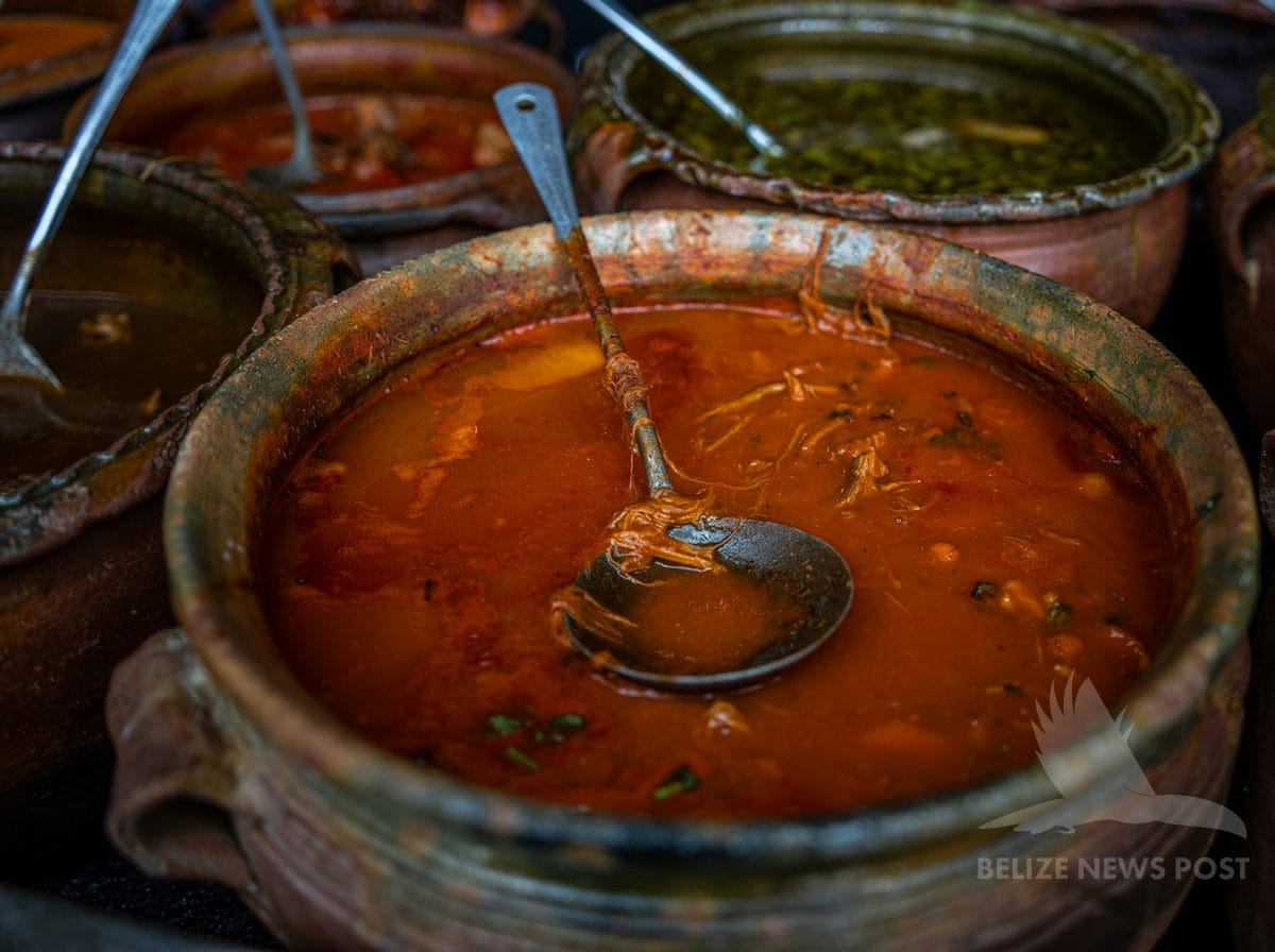 Rich thickened meat broth k'óol filling in clay pot for mukbipollo