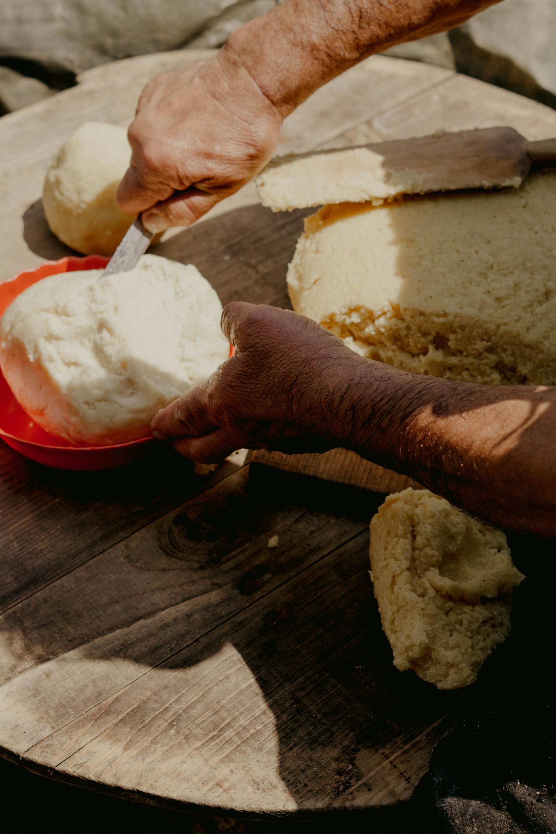fresh masa dough being portioned by hand into balls for panuchos yucatecos tortillas