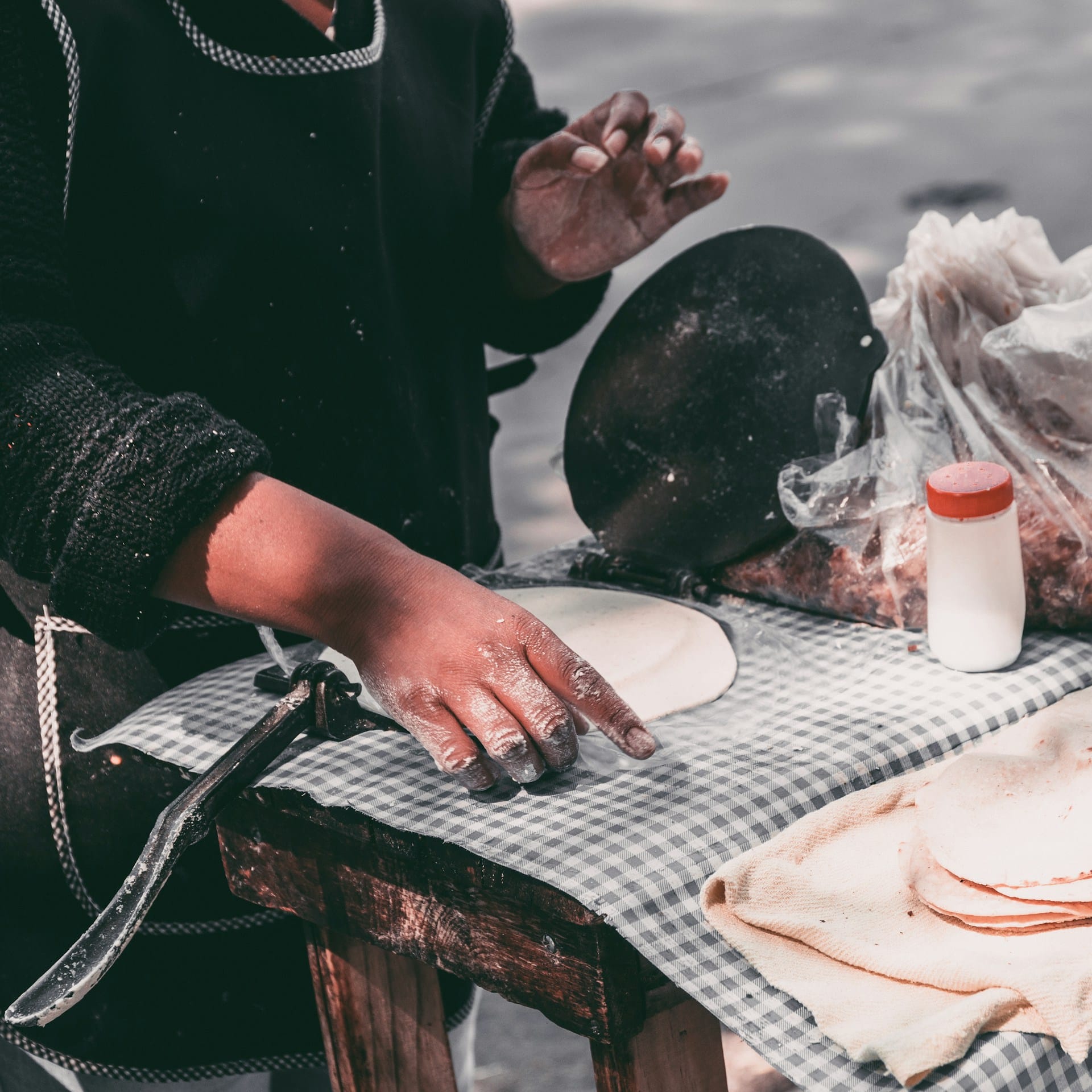 woman making tortillas at a Yucatan street food market — panuchos are a staple in Chetumal and Merida, well known to Belizeans who cross the border regularly