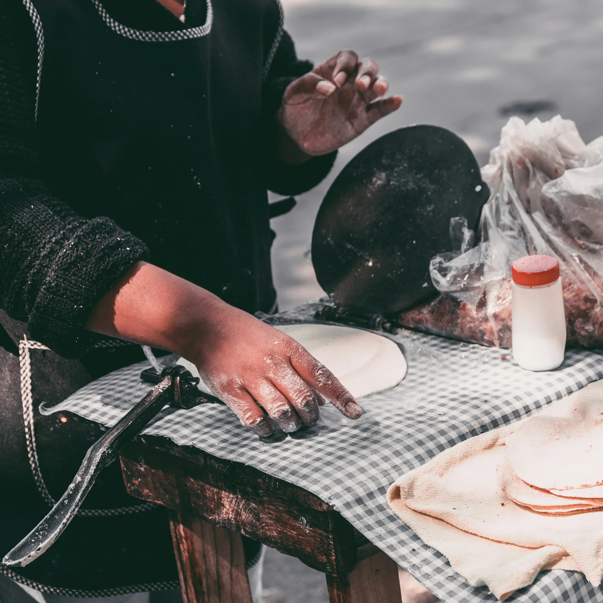 woman making tortillas at a Yucatan street food market — panuchos are a staple in Chetumal and Merida, well known to Belizeans who cross the border regularly