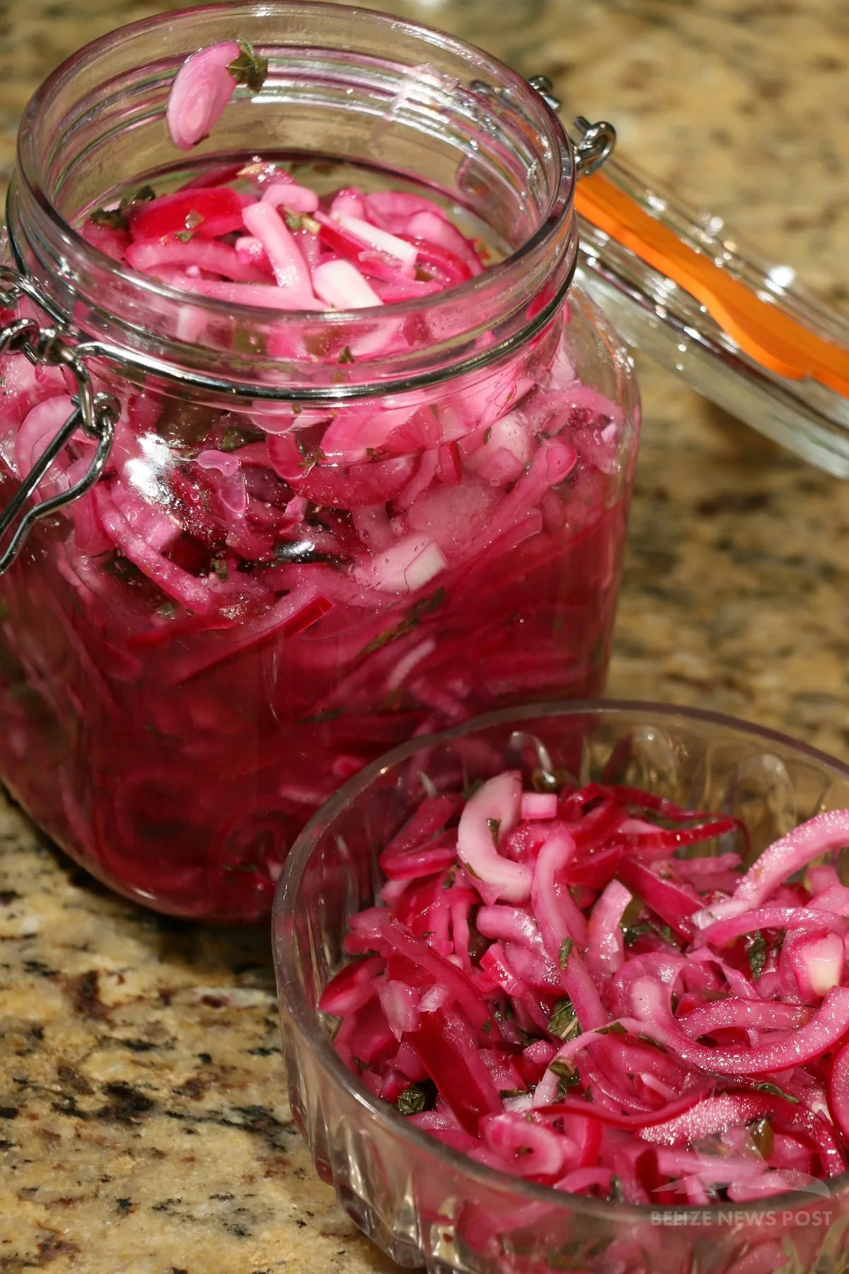 pickled red onion in a jar and serving bowl — the traditional habanero and sour orange accompaniment for polcanes