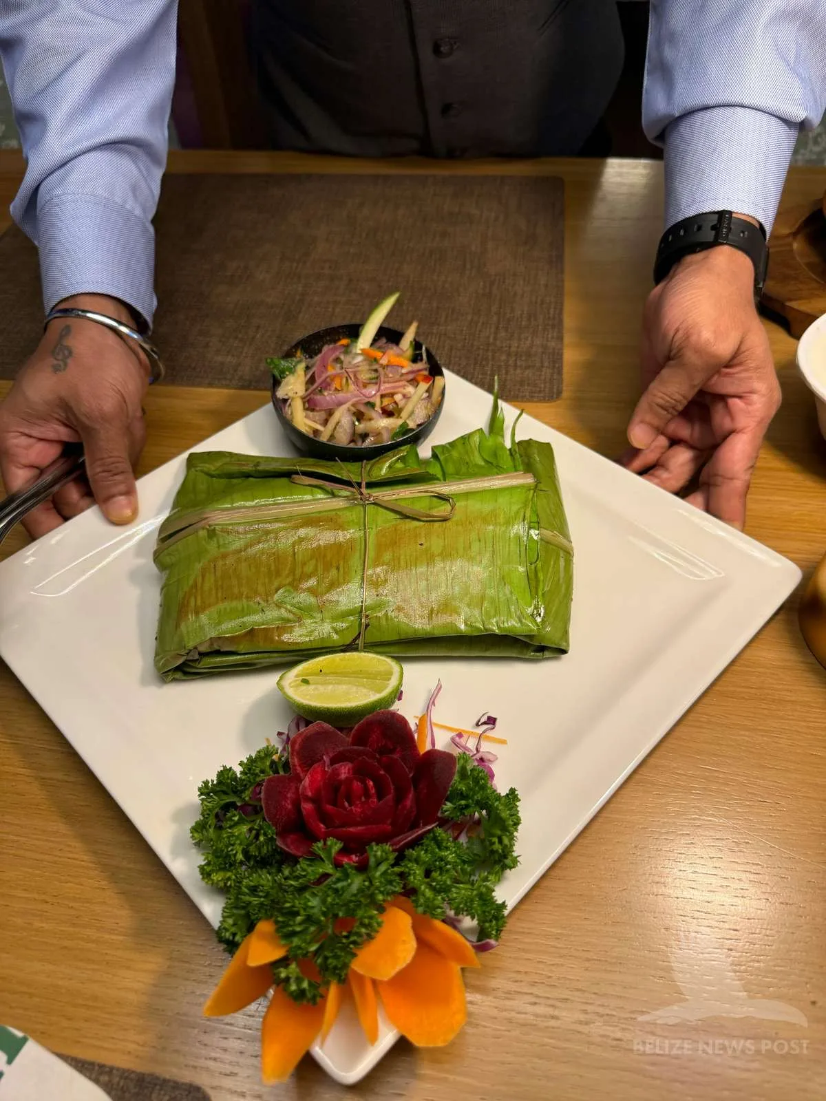 Tamales colados plated in banana leaf — belize news post