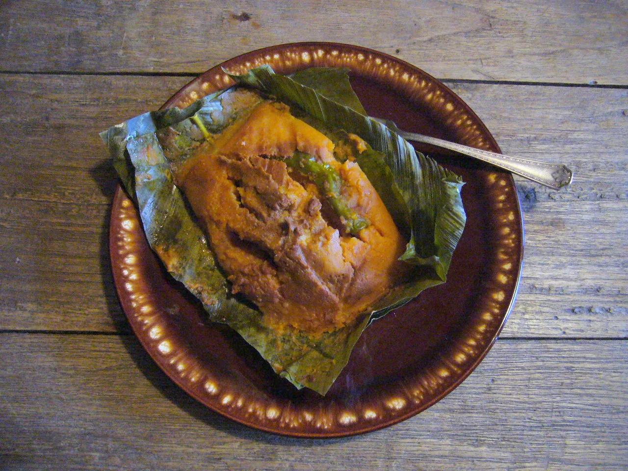 Guatemalan paches, potato-masa tamales steamed in banana leaf