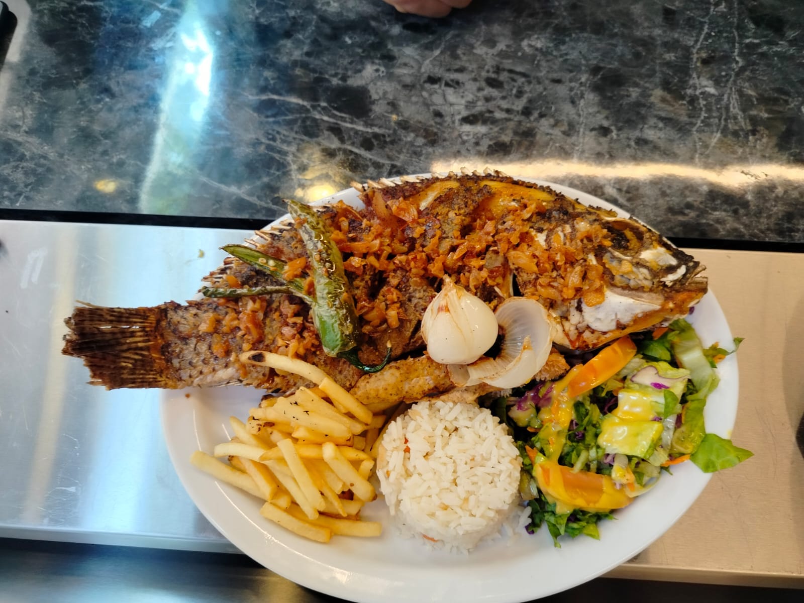 A whole fish fried until the skin crackles, the style served as pescado frito across Honduras