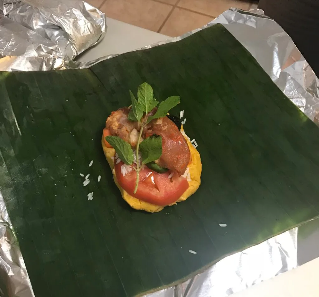 Honduran nacatamal wrapped in banana leaf and aluminum foil, ready to steam
