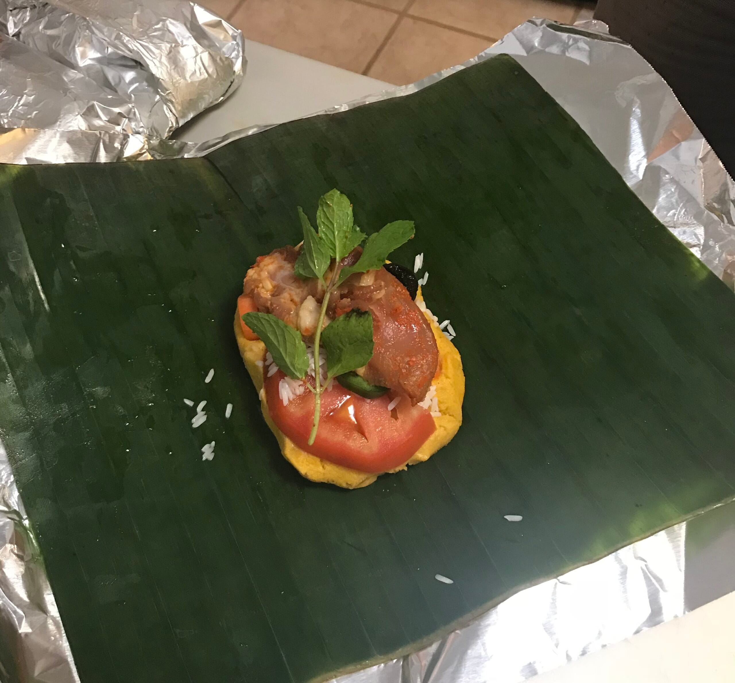 Honduran nacatamal wrapped in banana leaf and aluminum foil, ready to steam