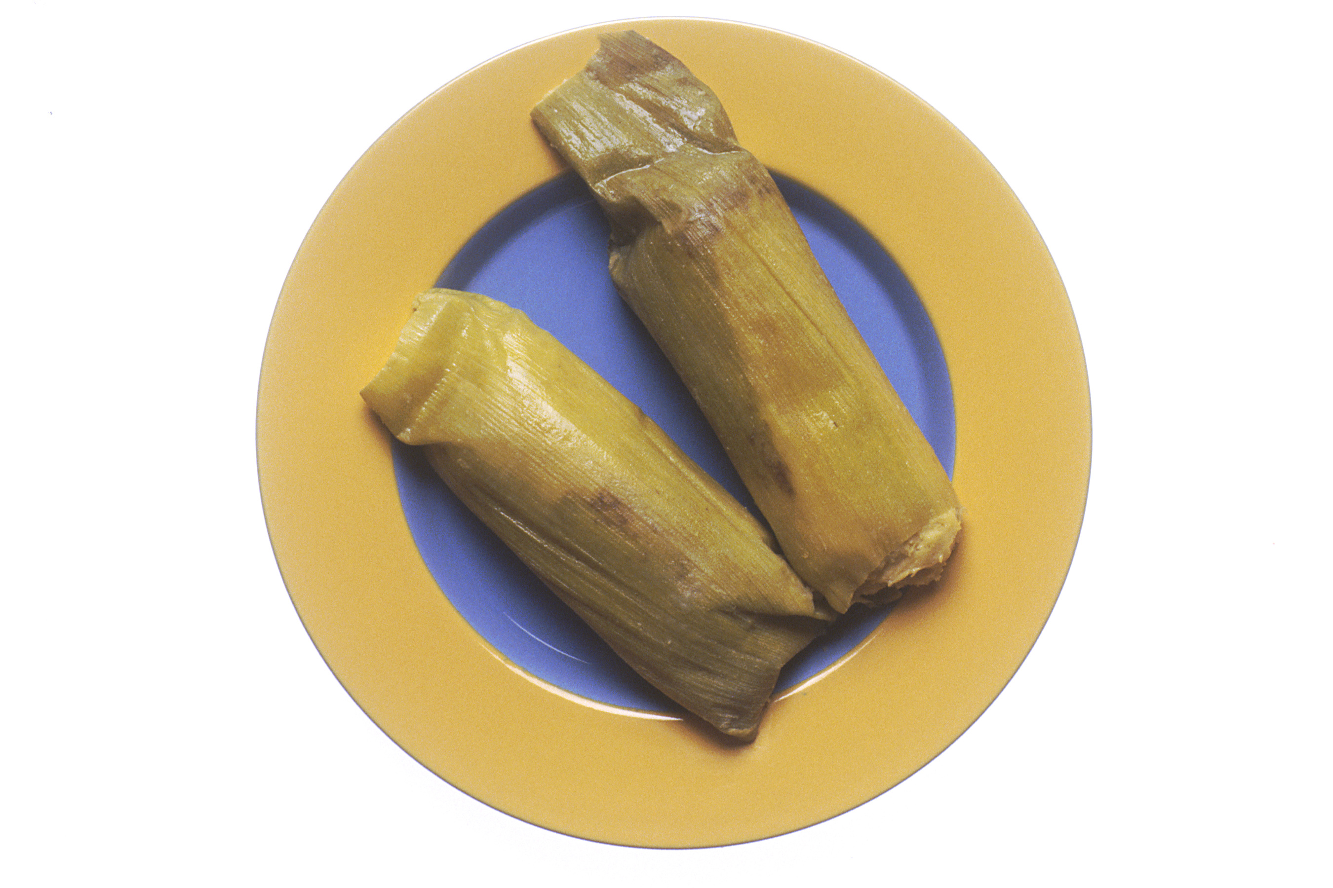 Tamales de elote, traditional Salvadoran sweet corn tamales wrapped in corn husks