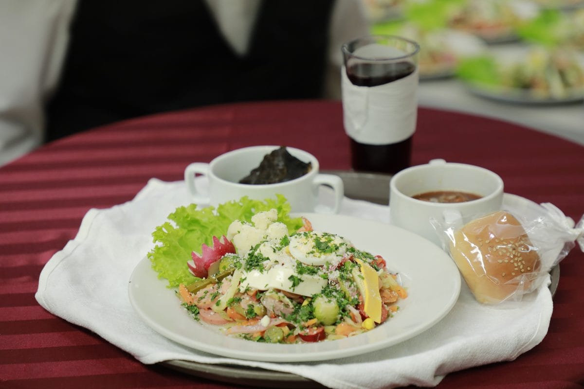 A plate of Guatemalan fiambre, a composed cold salad of vegetables, meats, and cheese
