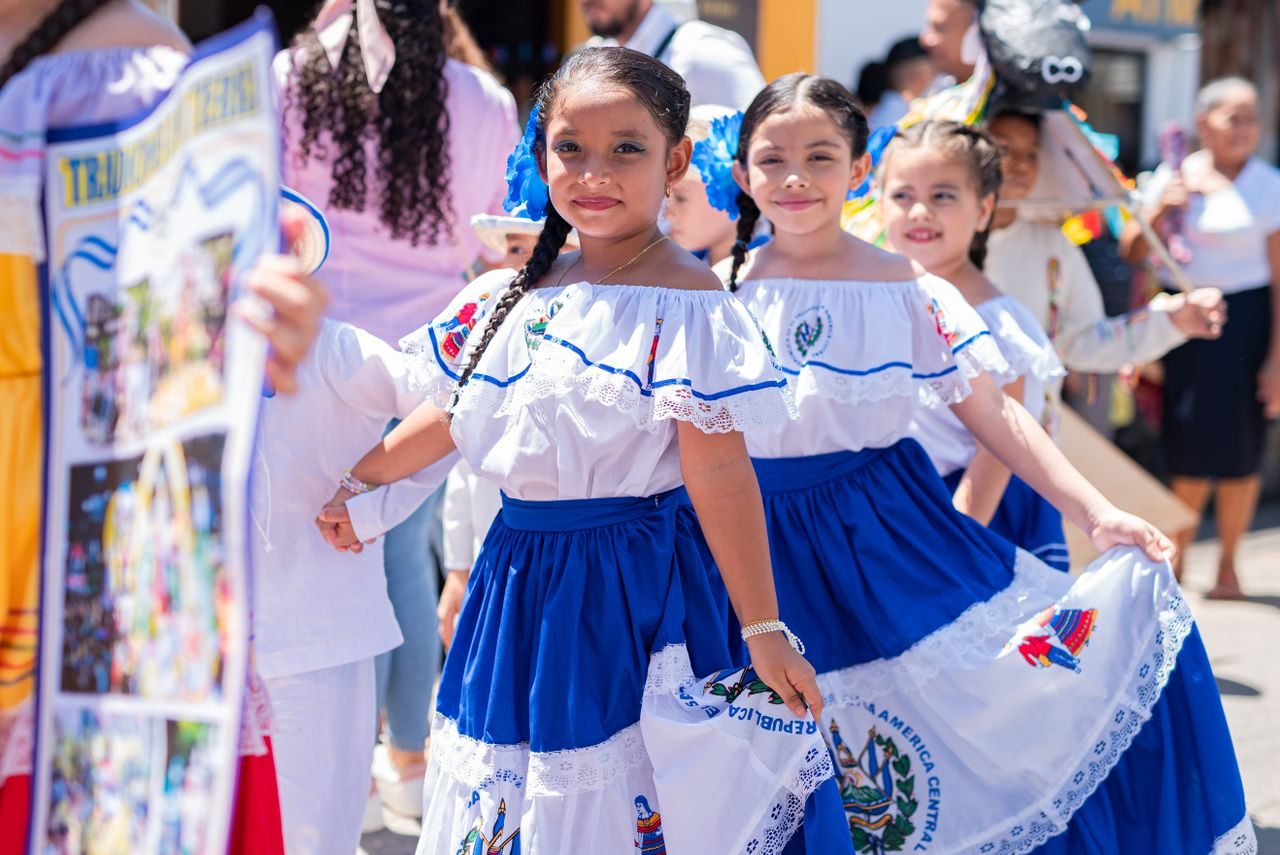 Honduran girls in traditional blue-and-white folk dress at a festival
