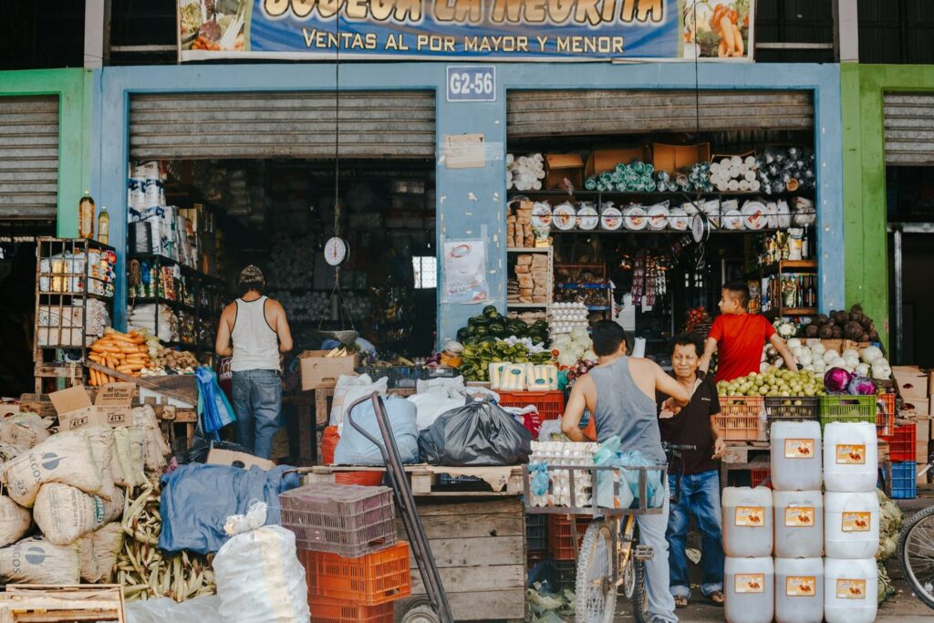 Busy food market in Honduras with produce, grains, and dry goods