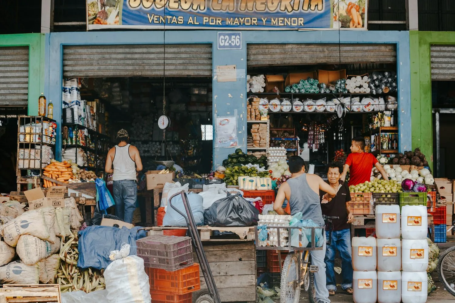 Busy food market in Honduras with produce, grains, and dry goods