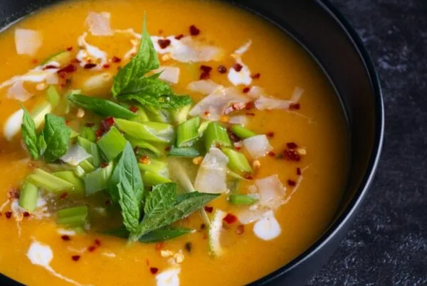A red spiced Guatemalan soup finished with mint and scallion, kak ik