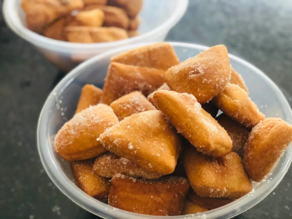 Nuégados de yuca golden Salvadoran cassava fritters served in bowls