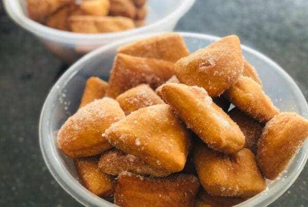 Nuégados de yuca golden Salvadoran cassava fritters served in bowls