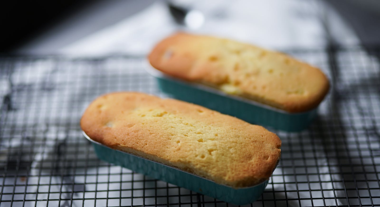 Homemade corn cookies cooling after baking, showing the rest-to-crisp step that gives tustacas their dry, crunchy texture