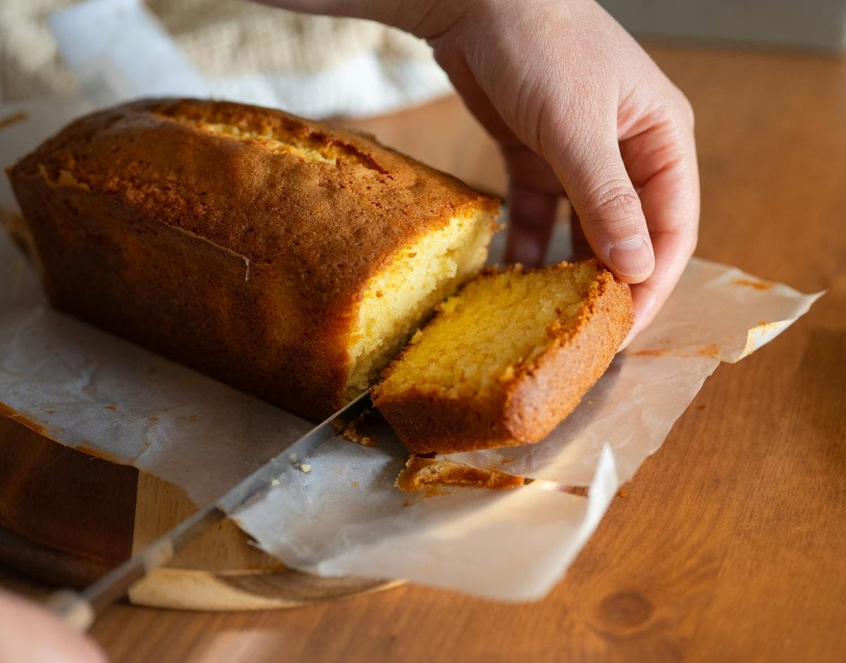 Quesadilla salvadoreña, a golden cheese pound cake, being sliced