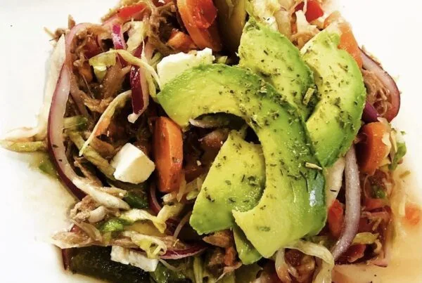 Salpicón, a cold chopped-beef salad with onion, tomato, and avocado