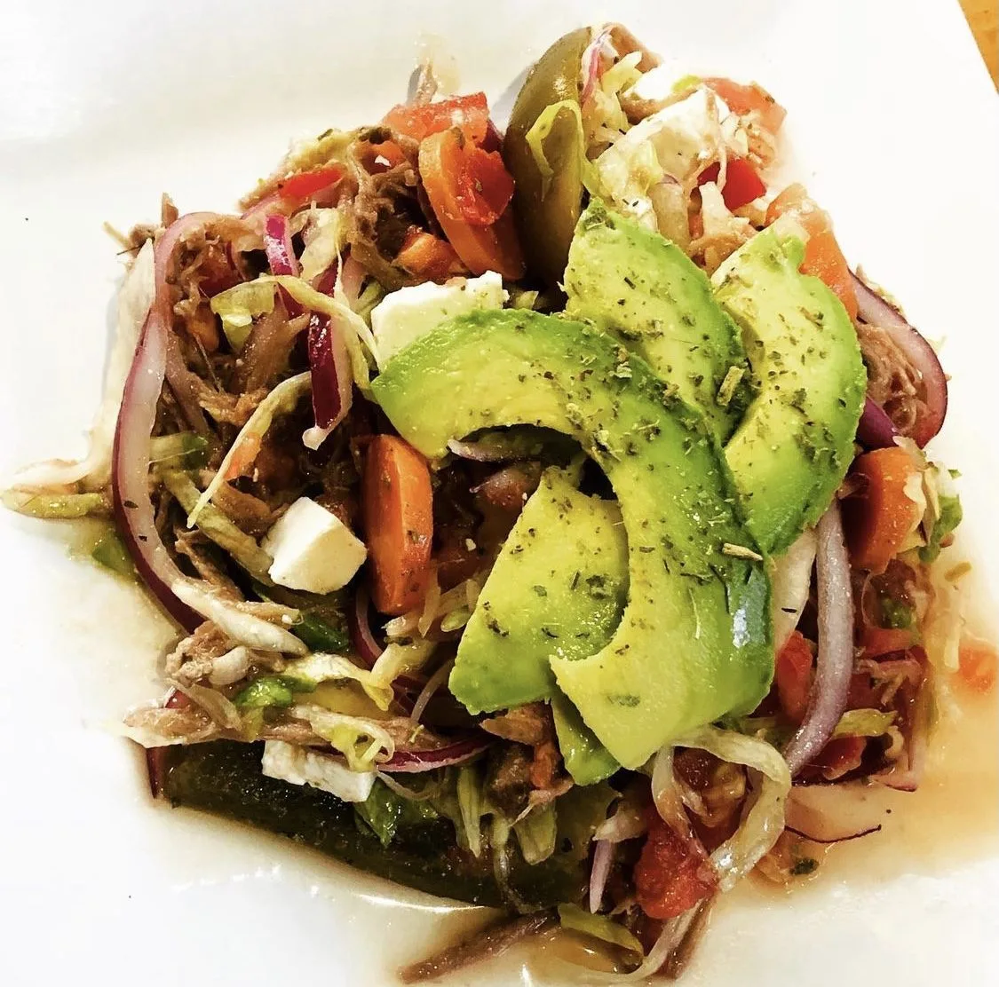 Salpicón, a cold chopped-beef salad with onion, tomato, and avocado