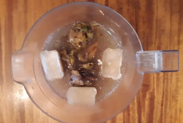 Chicha de piña, pineapple rinds steeping with spice, the fermented pineapple-panela base behind gallo en chicha