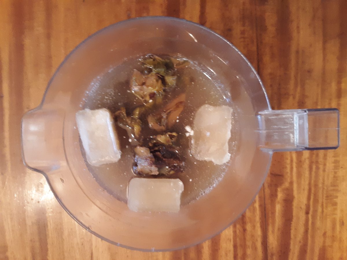 Chicha de piña, pineapple rinds steeping with spice, the fermented pineapple-panela base behind gallo en chicha