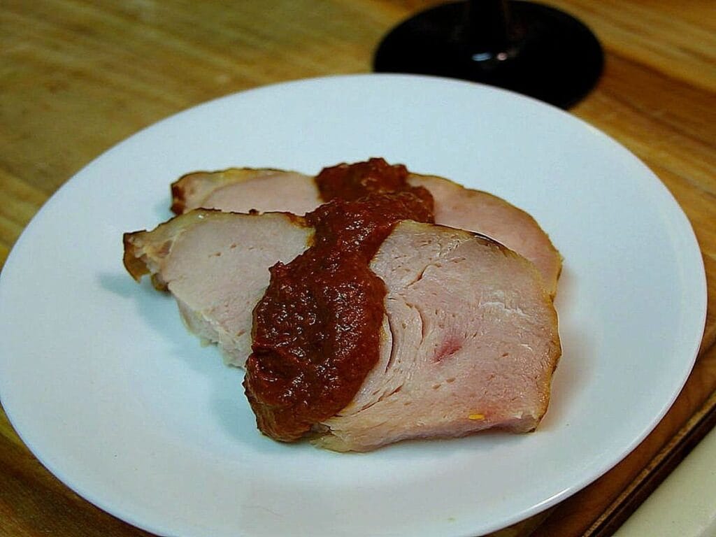 Sliced turkey napped with a dark seed-and-chile sauce, the braise-in-dark-sauce style of pavo en relajo