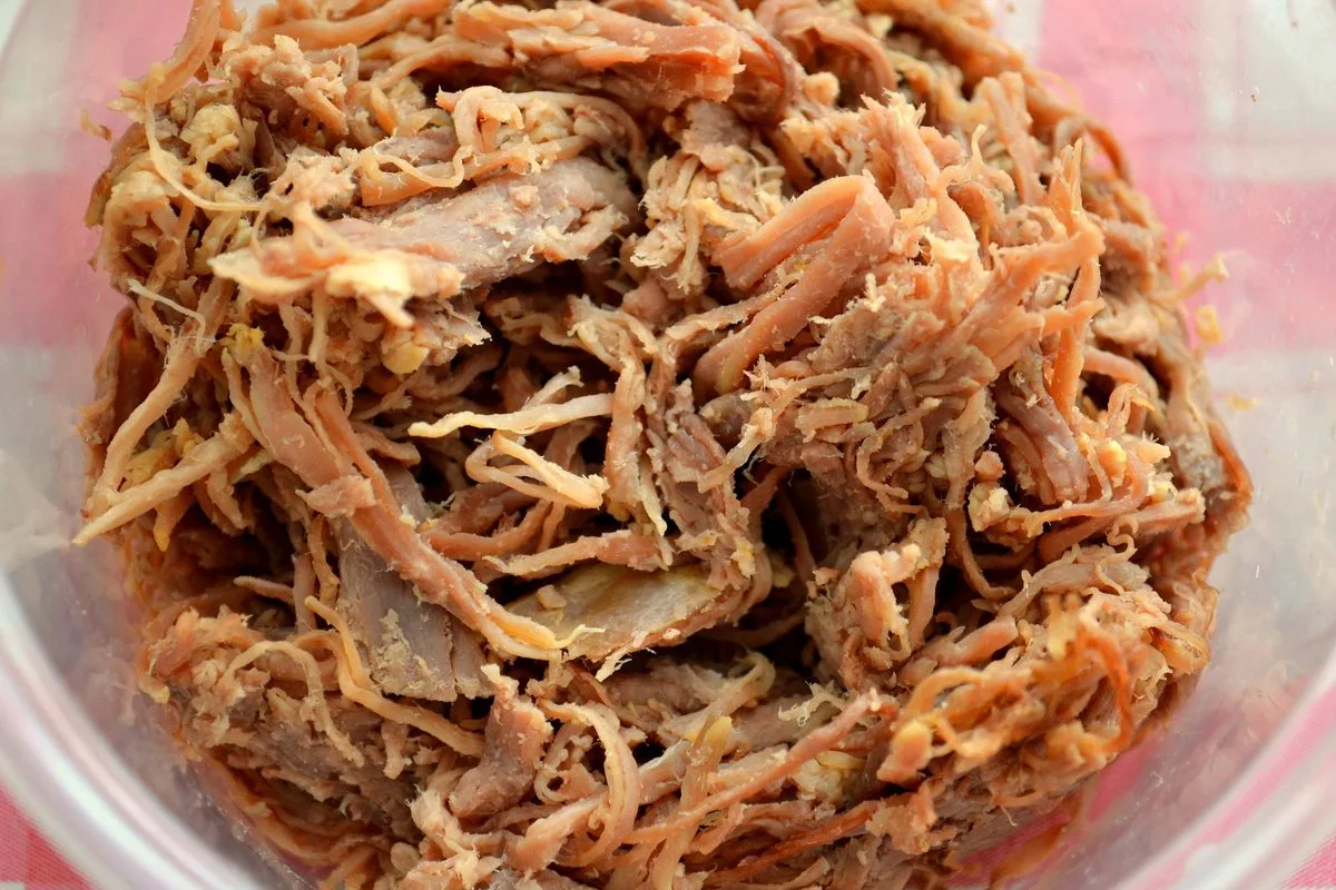 Boiled beef pulled into fine strands before frying