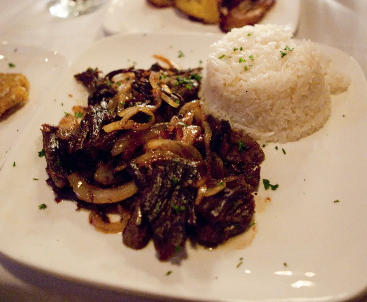 Crisp fried shredded beef with sauteed onion, served with white rice