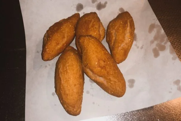 Jamaican festival, fried cornmeal dough rolled long and golden