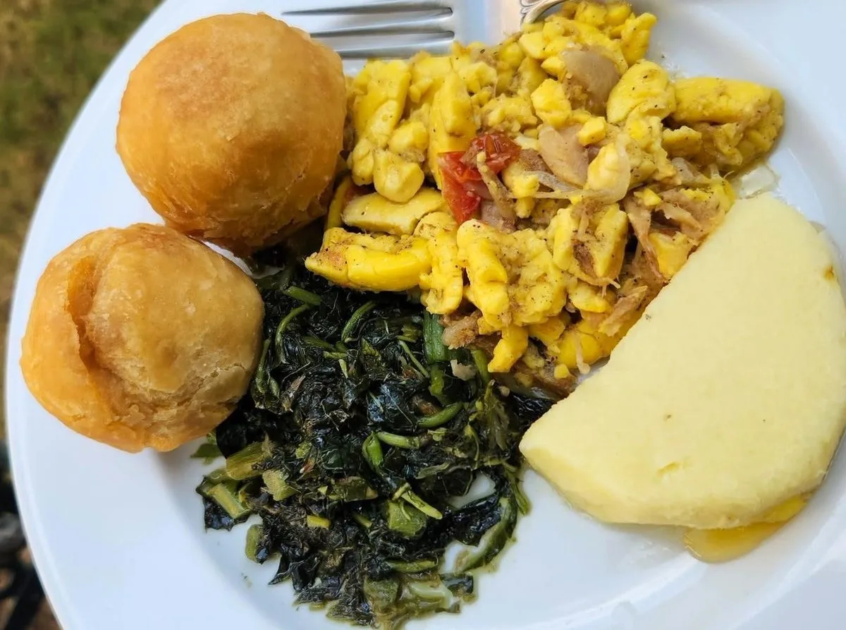Jamaican fried dumplings with ackee and saltfish, callaloo and yam
