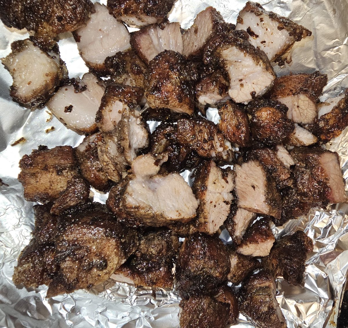 Jamaican jerk pork, chopped and dark from the fire
