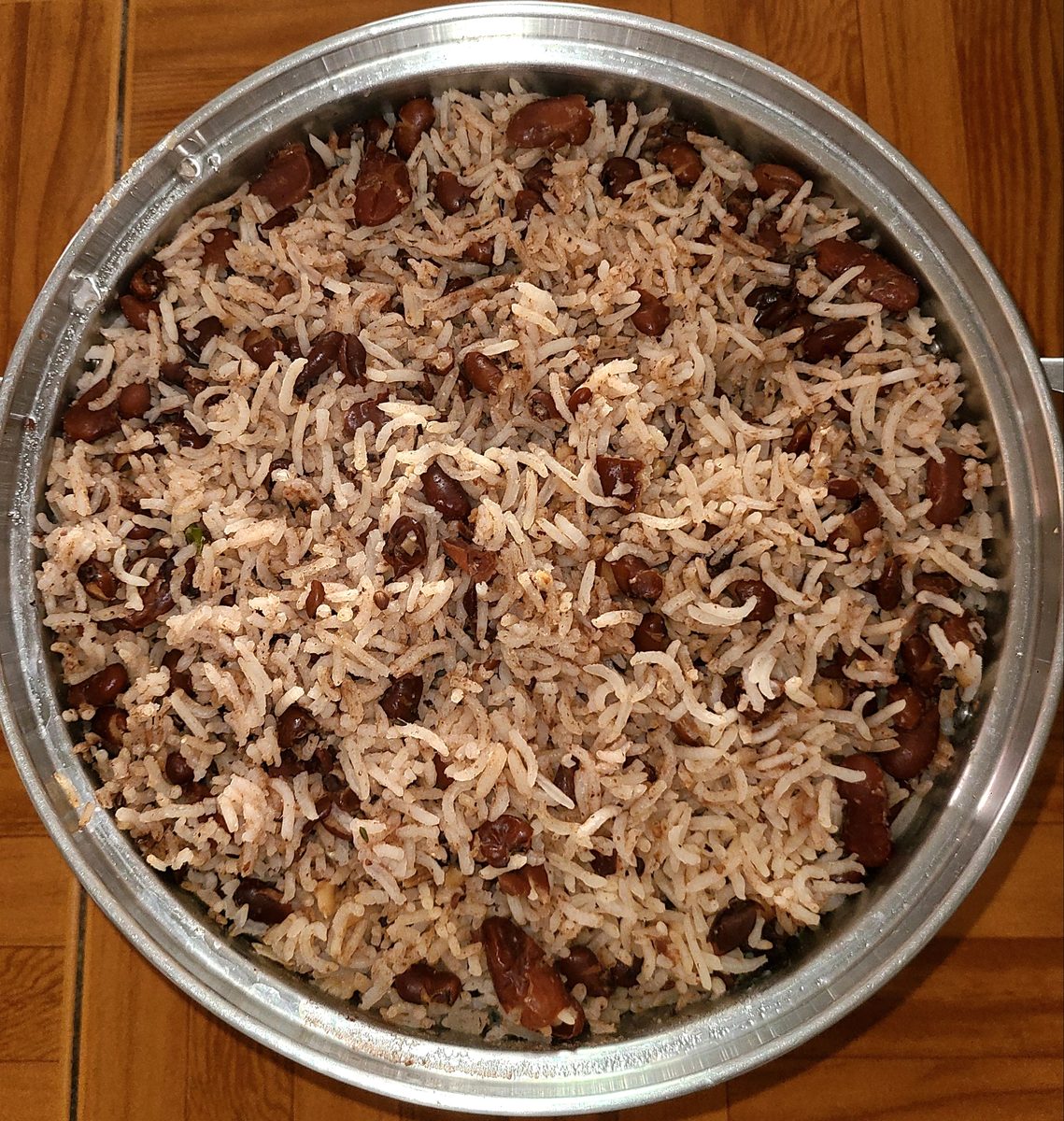 Jamaican rice and peas in a Dutch pot, red kidney beans through separate grains of rice