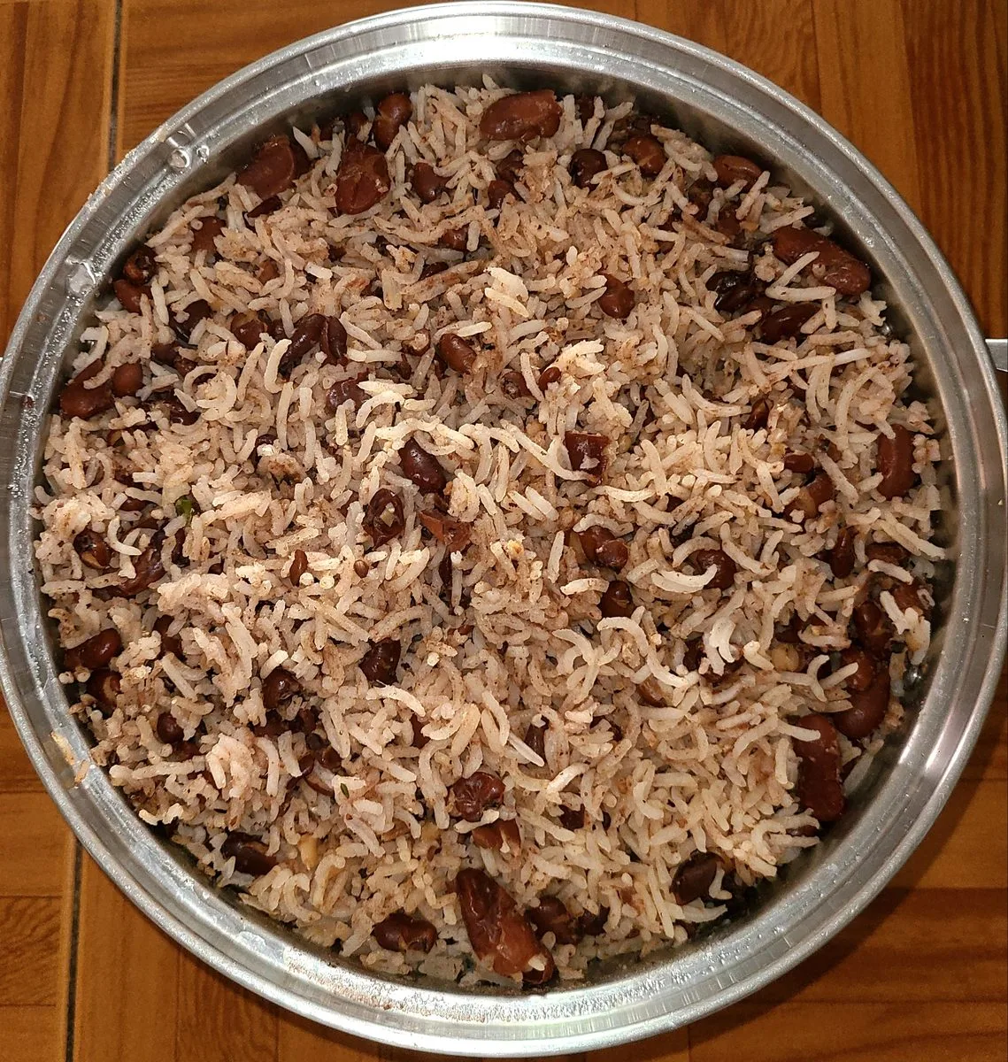 Jamaican rice and peas in a Dutch pot, red kidney beans through separate grains of rice