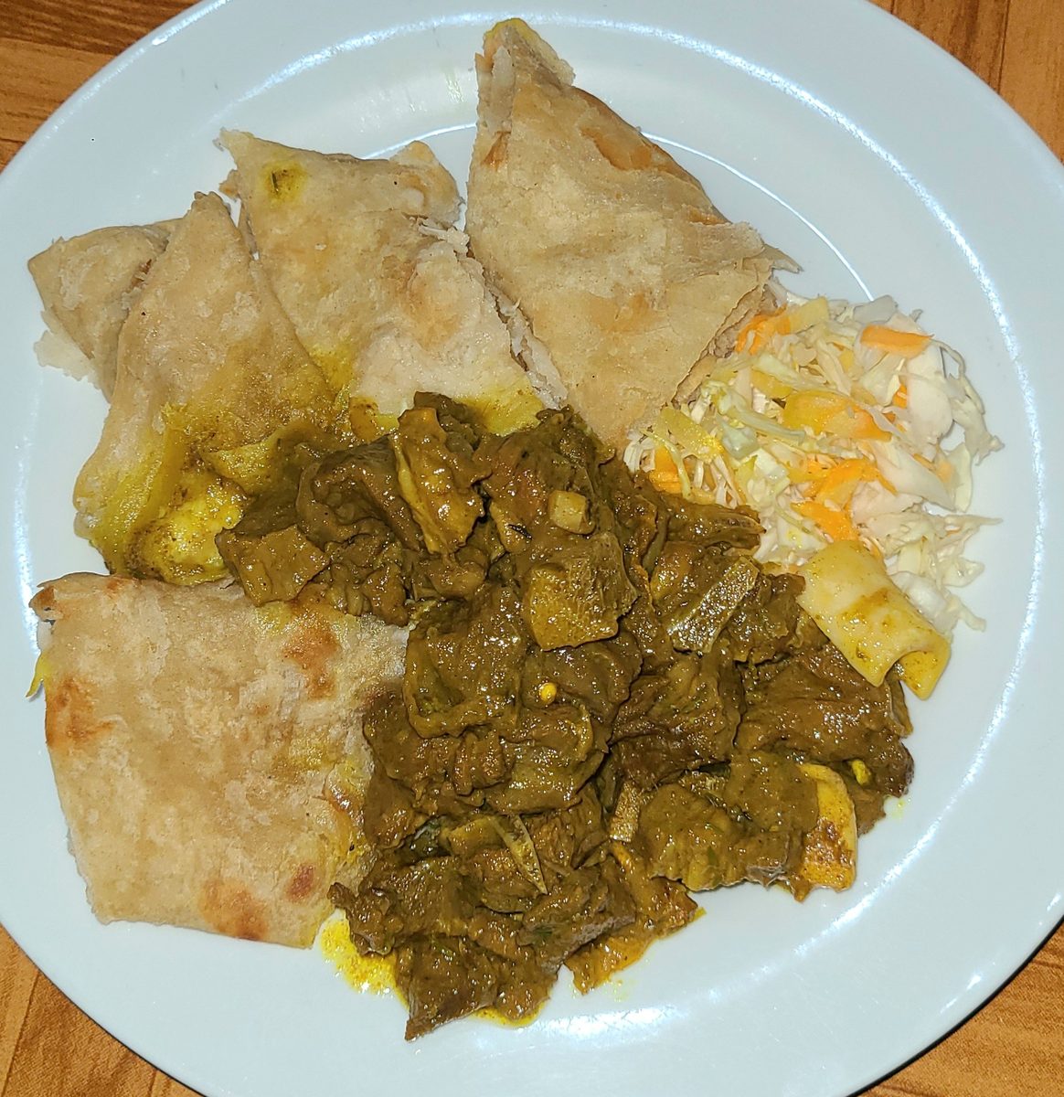 Jamaican roti served with curry goat