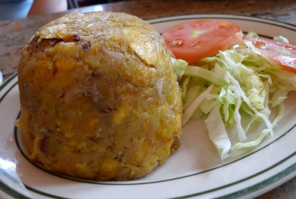 Dome of Puerto Rican mofongo with chicharron, served with salad