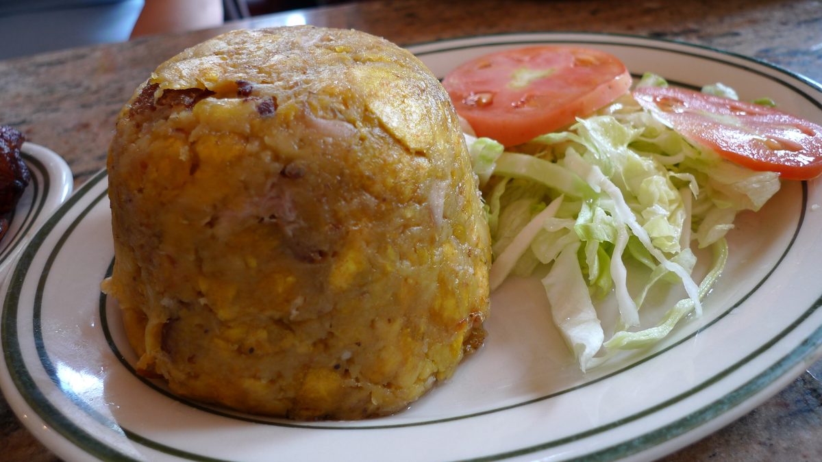 Dome of Puerto Rican mofongo with chicharron, served with salad