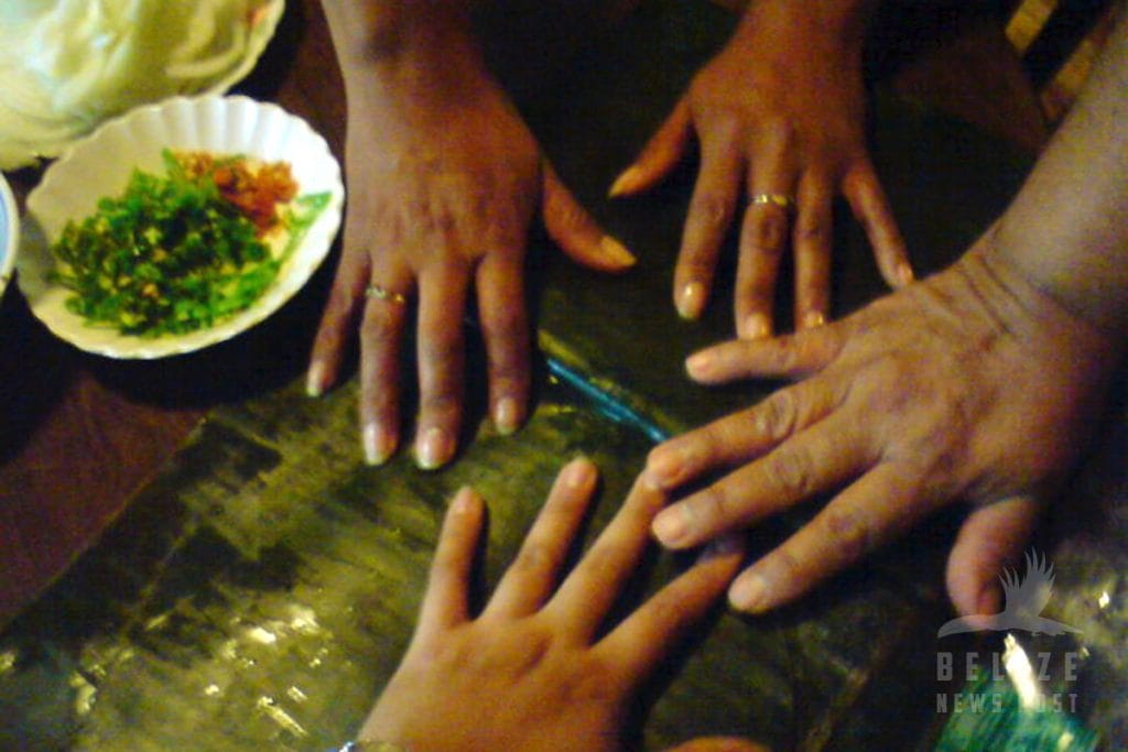 Many Hands to make Belizean Tamales