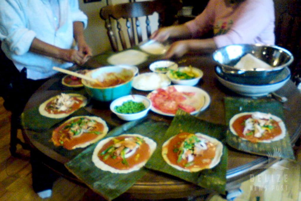 Assembling Belizean Tamales