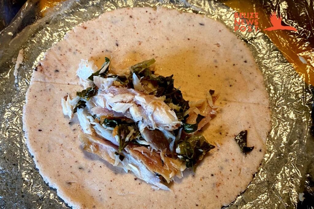 Filling the Panades with fish and optional kale.