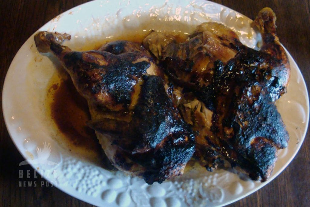 Chicken quarters boiled in soup broth then removed and broiled with Worchester sauce brushing.