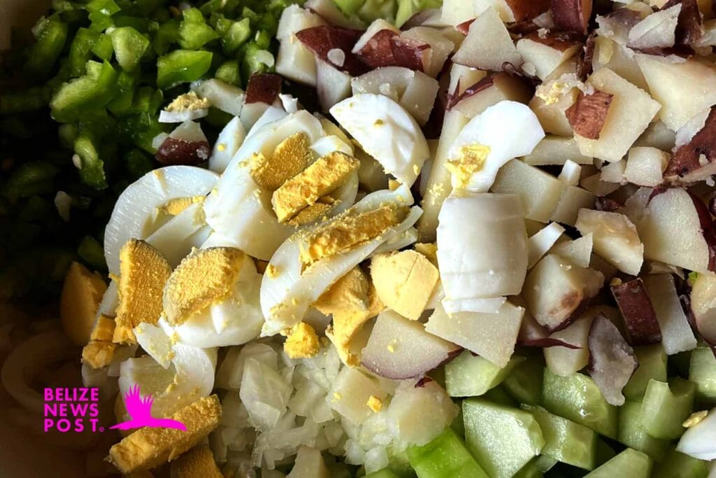 Belizean Potato Salad Recipe: Chopped ingredients seasoned. 