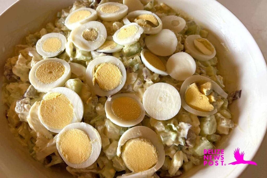 Belizean Potato Salad Recipe Completed  and Topped with Freshly Sliced Hard Boiled Eggs