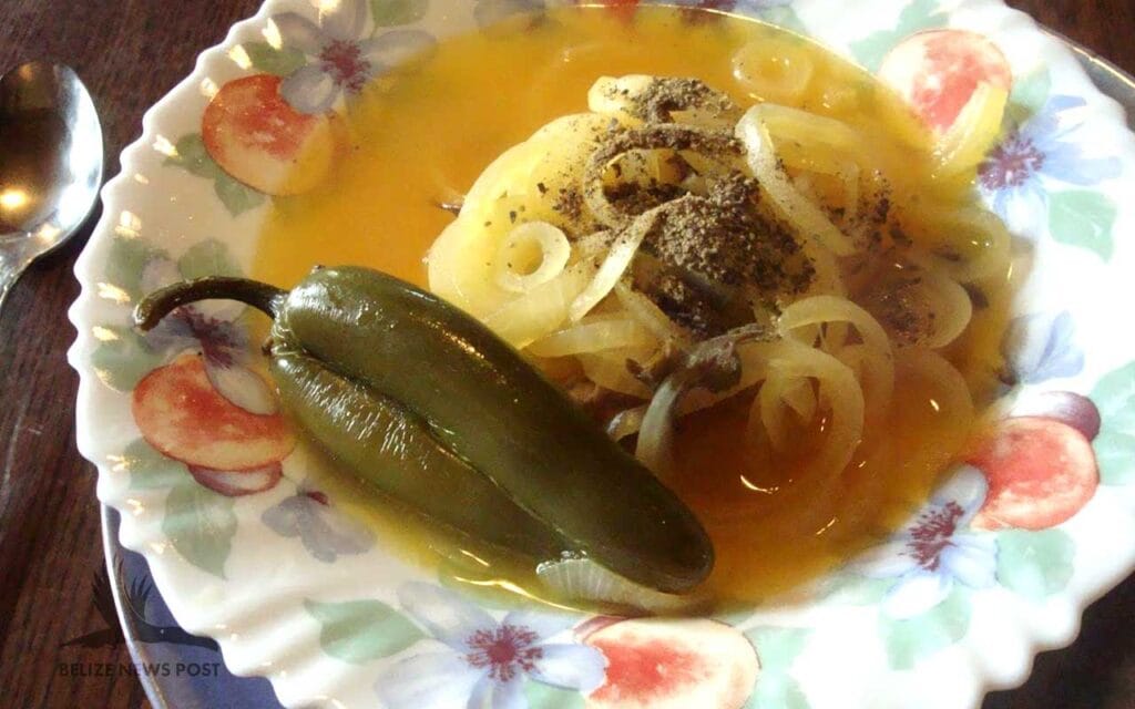 Belizean Escabeche Soup Recipe - Completed soup with freshly ground black pepper.