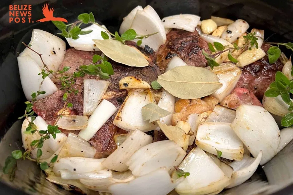 Belizean Beef Soup ingredients in pot cooking
